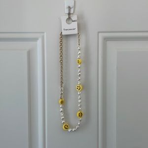 Francesca’s smiley face necklace